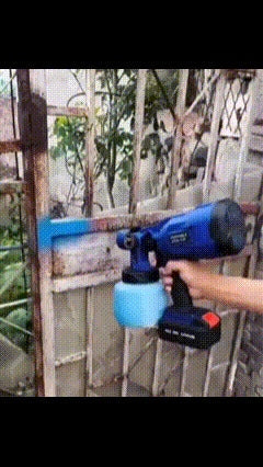 Cordless paint sprayer in use